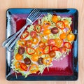 Plate of fresh salad with savoy cabbage, colorful tomatoes Royalty Free Stock Photo