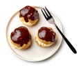 Plate of freshly baked cream puffs