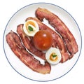 Fried Bacon Rashers With Hard Boiled Garnished Egg Slices And Tomato Set On White Porcelain Plate Isolated On White Background Royalty Free Stock Photo