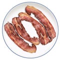 Four Fried Gourmet Well Done Bacon Rashers Set On White Porcelain Plate Isolated On White Background Royalty Free Stock Photo
