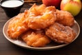 a plate of fried doughnuts