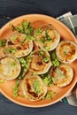 Plate of fried dumplings overhead closeup