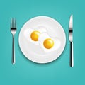 Plate With Fried Eggs Heart Fork And Knife With Mint Cloth