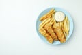 Plate with fried fish and chips, and sauce on white background Royalty Free Stock Photo