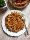 A plate of fried noodle served on kitchen table