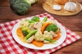 Plate of fried vegetables with cauliflower, mushroom, carrot and Royalty Free Stock Photo