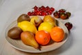 Plate with fruit and tomatoes