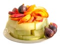 Plate with fruits, melon, peaches and figs isolated on a white background