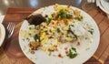 Basket Chaat platter, stuffed with potato, sprouts and flooded with curd, chutney and fresh fruits,a tasty snak of north indiaor Royalty Free Stock Photo