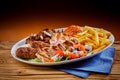 Plate full of Greek cuisine souvlaki with fries Royalty Free Stock Photo