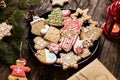 Plate full of home baked tasty ginger cookies and biscuits glazed in winter holiday themes, merry Christmas and happy New Year, Royalty Free Stock Photo