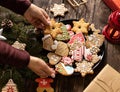 Plate full of home baked tasty ginger cookies and biscuits glazed in winter holiday themes, merry Christmas and happy New Year, Royalty Free Stock Photo