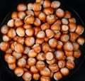 The plate is full of ripe hazelnuts Royalty Free Stock Photo