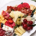 Plate full of tasty assorted appetizers, closeup