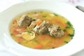 Plate full of typical Czech chicken broth with liver dumplings. Wedding soup close-up. Royalty Free Stock Photo