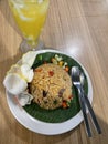 a plate of goat fried rice and orange coconut ice