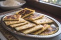 a plate of golden crispy bammy cassava flatbread Royalty Free Stock Photo