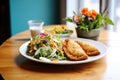 plate of golden empanadas with a side salad