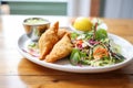 plate of golden empanadas with a side salad