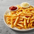 Plate of golden French fries or Pommes Frites Royalty Free Stock Photo