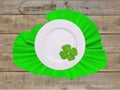 Plate on green napkin with clover leaf for St Patricks Day