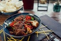 Plate with grilled beef vegetables and chili, chopsticks Royalty Free Stock Photo