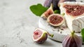 Plate with camembert, fig fruits and fresh basil on a white background Royalty Free Stock Photo