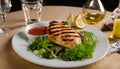 A plate of grilled chicken and salad with a fork and knife