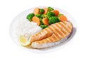 plate of grilled salmon, rice and vegetables on white background Royalty Free Stock Photo