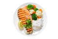 plate of grilled salmon steak, rice and vegetables isolated on white background Royalty Free Stock Photo