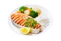 plate of grilled salmon steak, rice and vegetables on white background Royalty Free Stock Photo