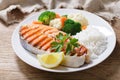 plate of grilled salmon steak, rice and vegetables Royalty Free Stock Photo