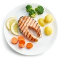Plate of grilled salmon steak and vegetables Royalty Free Stock Photo