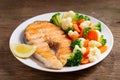 Plate of grilled salmon steak with vegetables Royalty Free Stock Photo