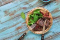 Plate with grilled steak, spinach, pomegranate on wooden blue ta Royalty Free Stock Photo