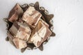 plate with halva from sunflower seeds on a bronze tray, selective focus. Still life with halva in Arabic style. copy Royalty Free Stock Photo