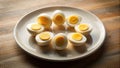 A plate of halved hard-boiled eggs arranged in a circular pattern on a wooden surface. Generative AI Royalty Free Stock Photo