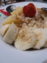 A plate of happiness, oat porridge with banana and strawberry