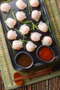 Plate of har gow dumplings, which is made a Chinese dumpling made of shrimp closeup on the table. Vertical top view Royalty Free Stock Photo