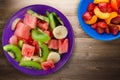 Plate of healthy fresh fruit salad on wooden background Royalty Free Stock Photo