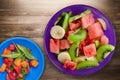 Plate of healthy fresh fruit salad on wooden background Royalty Free Stock Photo