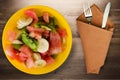 Plate of healthy fresh fruit salad on wooden background Royalty Free Stock Photo