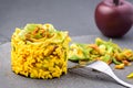 Plate of healthy zucchini rice with flowers and saffron