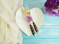 plate heart, fork, knife flower chrysanthemum, setting beautiful elegant party bell, on a wooden background Royalty Free Stock Photo