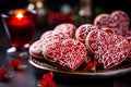 A plate of heart-shaped cookies decorated with red icing and white patterns. Homemade baking. Valentine's Day Royalty Free Stock Photo