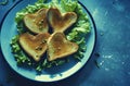 a plate of heart shaped toast with salad and lettuce Royalty Free Stock Photo