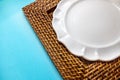 A support for plates made of straw in varnish. Royalty Free Stock Photo