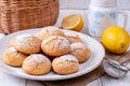 Plate with homemade lemon cookies on wooden table Royalty Free Stock Photo