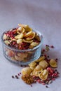 Plate of homemade muesli with cornflakes, freeze dried strawberry, walnuts, chocolate balls, pumpkin seeds Royalty Free Stock Photo