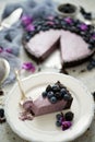 Plate with homemade piece of delicious blueberry, blackberry and grape pie or tart served on table Royalty Free Stock Photo